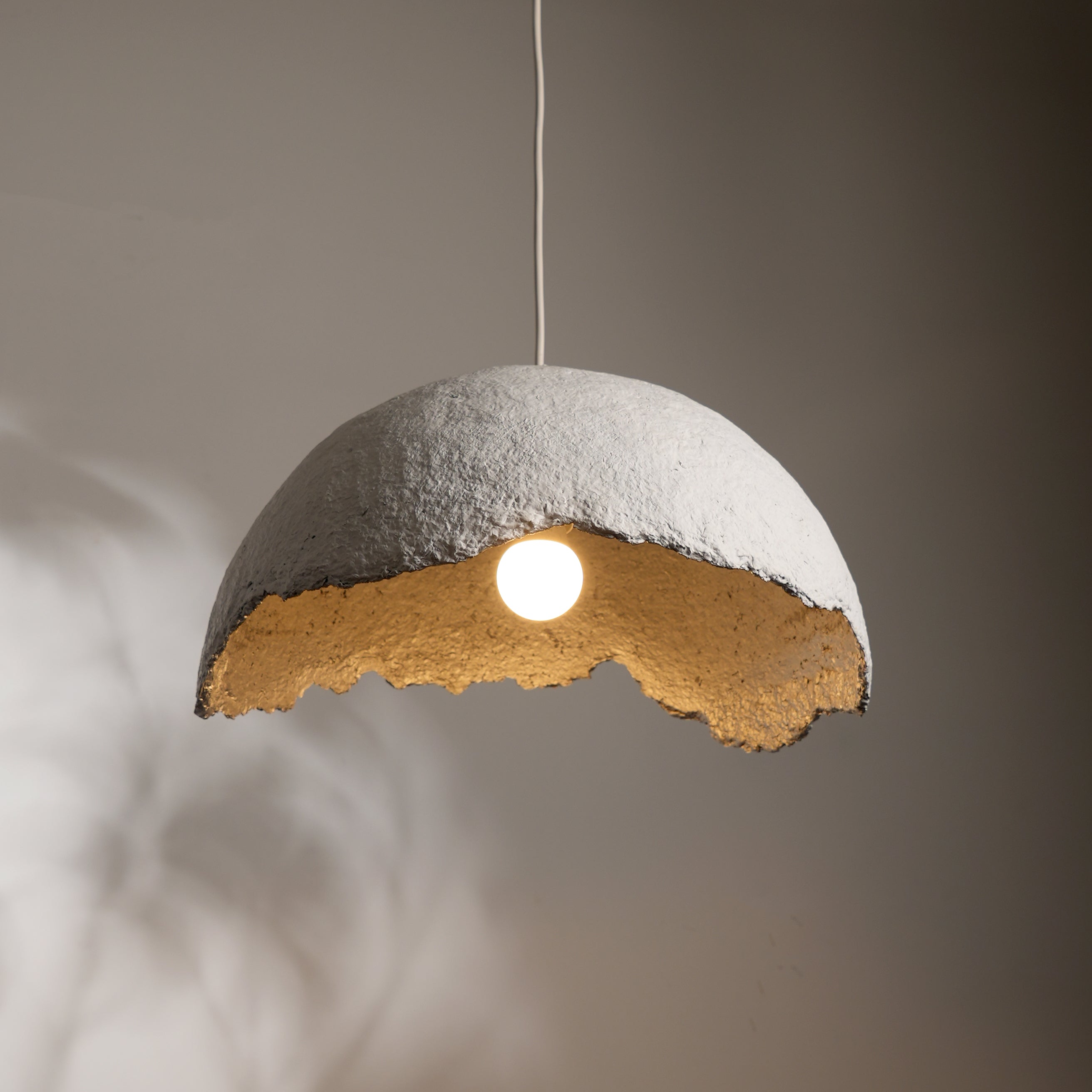 Offers Modern paper mache light for unique interiors, pendant lighting